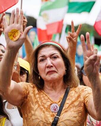 מפגינה איראנית נגד המשטר בבריסל | AFP מפגינה איראנית נגד המשטר בבריסל | AFP