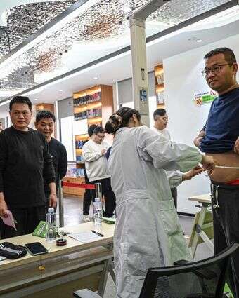 משתתפים בתוכניות לירידה במשקל בסין | AFP משתתפים בתוכניות לירידה במשקל בסין | AFP