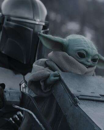 (L-R) The Mandalorian and Grogu in Lucasfilm's THE MANDALORIAN AND GROGU. Photo courtesy of Lucasfilm. © 2026 Lucasfilm Ltd™. All Rights Reserved. (L-R) The Mandalorian and Grogu in Lucasfilm's THE MANDALORIAN AND GROGU. Photo courtesy of Lucasfilm. © 2026 Lucasfilm Ltd™. All Rights Reserved.