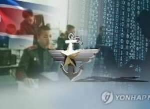 This undated captured image from Yonhap News TV shows North Korea's national flag and North Korean cyberwarfare personnel receiving training. (Yonhap)